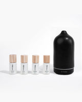 Basics Kit diffuser oils next to black scent diffuser