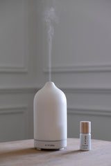 Peppermint diffuser oil next to Helse scent diffuser