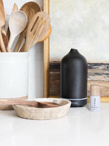 Moonlight Surf diffuser oil next to stone scent diffuser