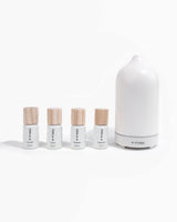 Basics Kit diffuser oils next to white scent diffuser