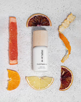 Fresh Squeezed diffuser oil blend surrounded by natural citrus ingredients